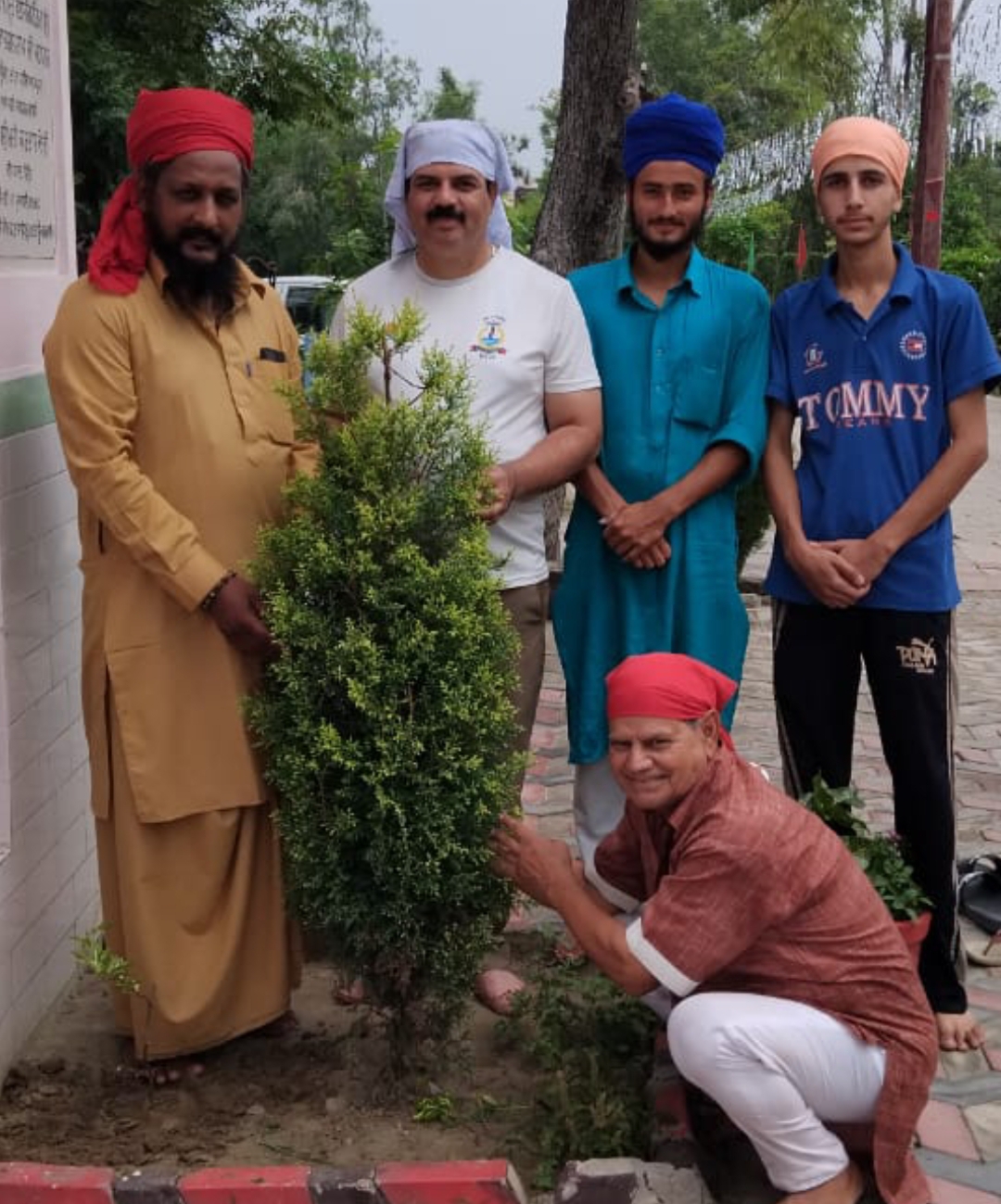 Celebrated his birthday by planting a flower plant at a religious place.